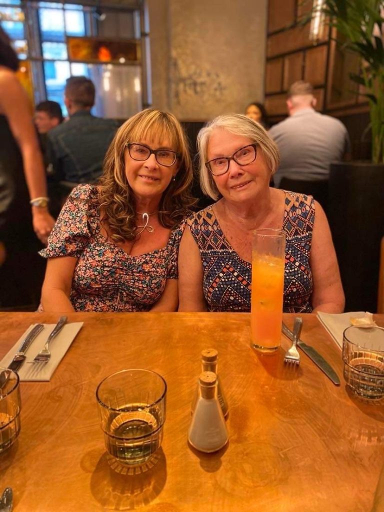 Sharon Skilbeck and her mum Isobel Howie pictured in a restaurant. Smiling at the camera.