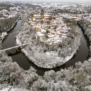 An aerial view of the city of Durham on a frosty snowy day