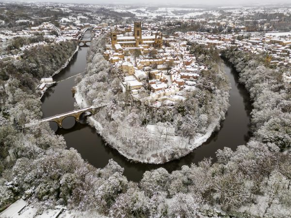 An aerial view of the city of Durham on a frosty snowy day