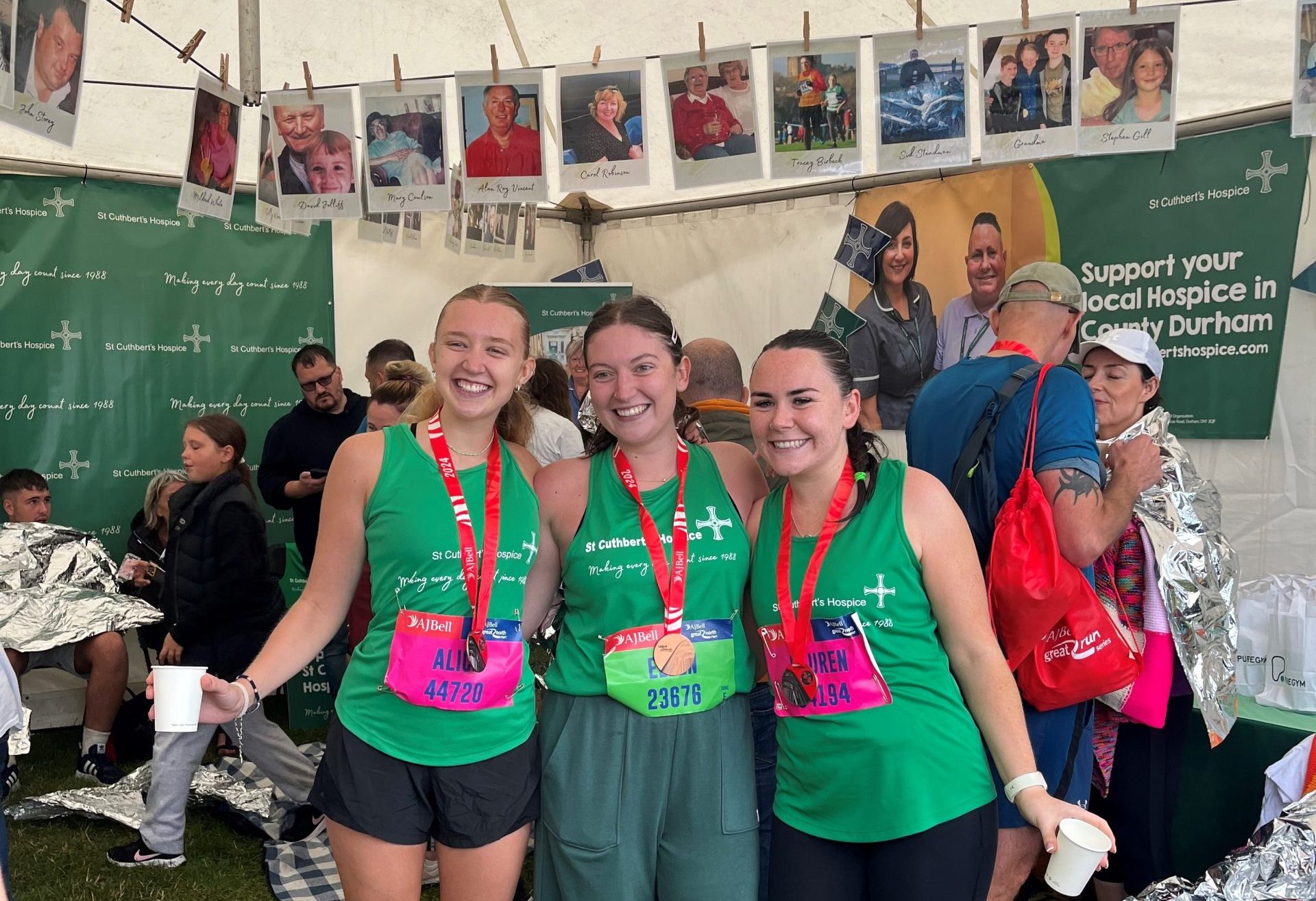 three young women pose with their medals